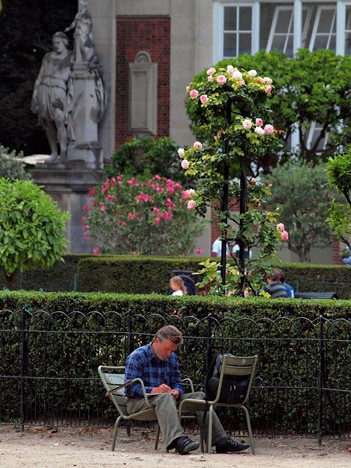 Man sitting on a chair working outside