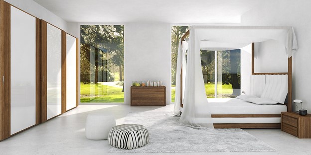 Natural daylighting can optimize energy efficiencies, all white bedroom with open space and lots of windows