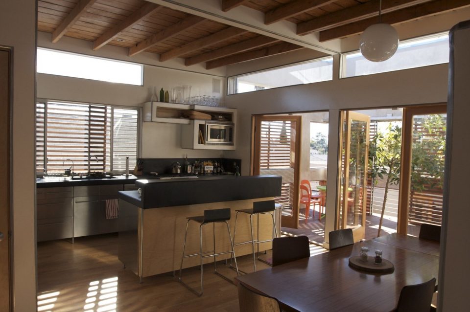 Sustainable kitchen with wooden doors and windows