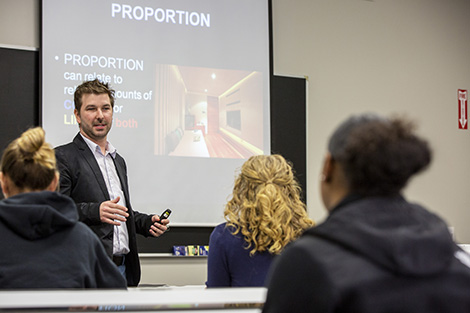 Male instructor teaching in front of class