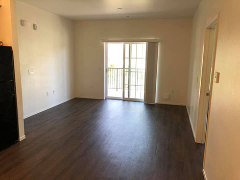 Before shot of the empty living room. Photo credit: Humble Design San Diego