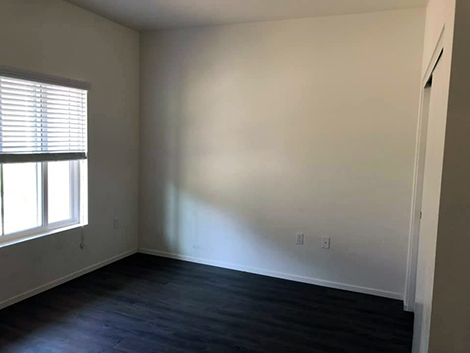 Before shot of the empty master bedroom. Photo credit: Humble Design San Diego