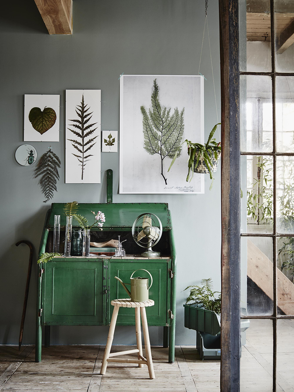 This emerald desk coupled with the delicate botanische prints above make for a charming little workspace.