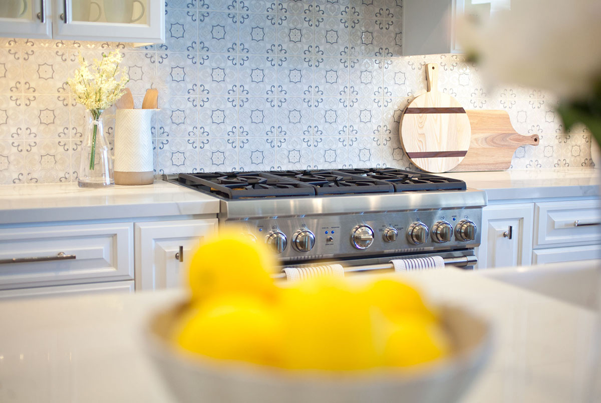 Details of a kitchen remodel by JY Design Interiors. Close up on back splash tiles above stove