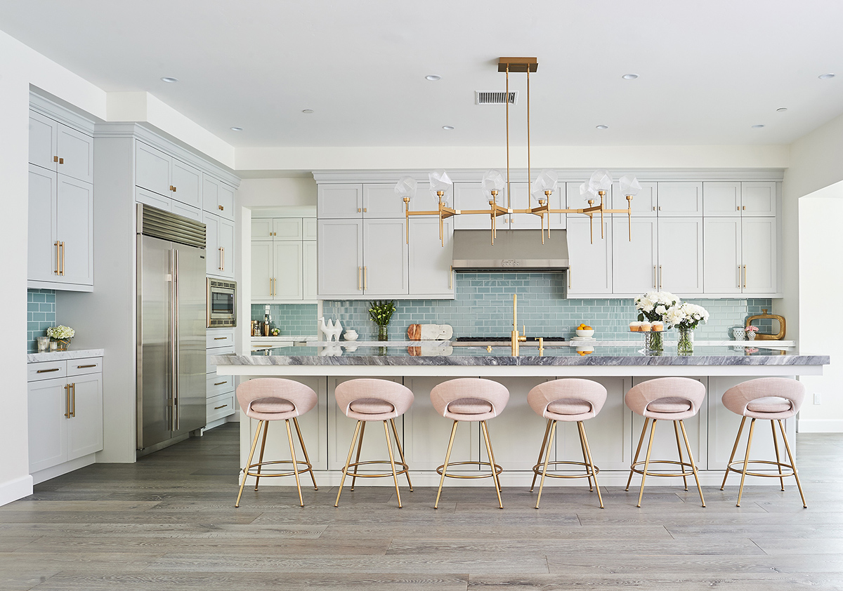 Pink barstools line a new kitchen island in a kitchen remodel done by Jaki Yermian of JY Design Interiors