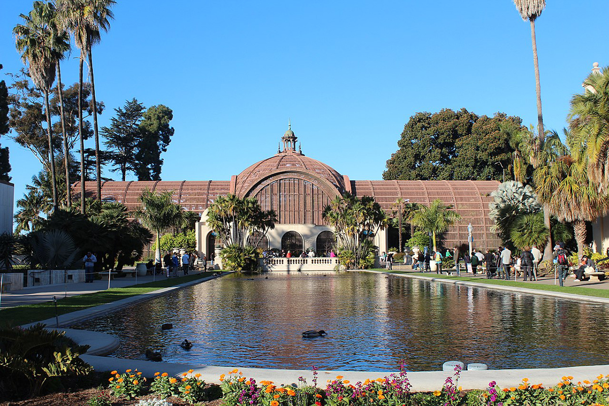 A shot of the botanical building in Balboa Park from across the koi pond